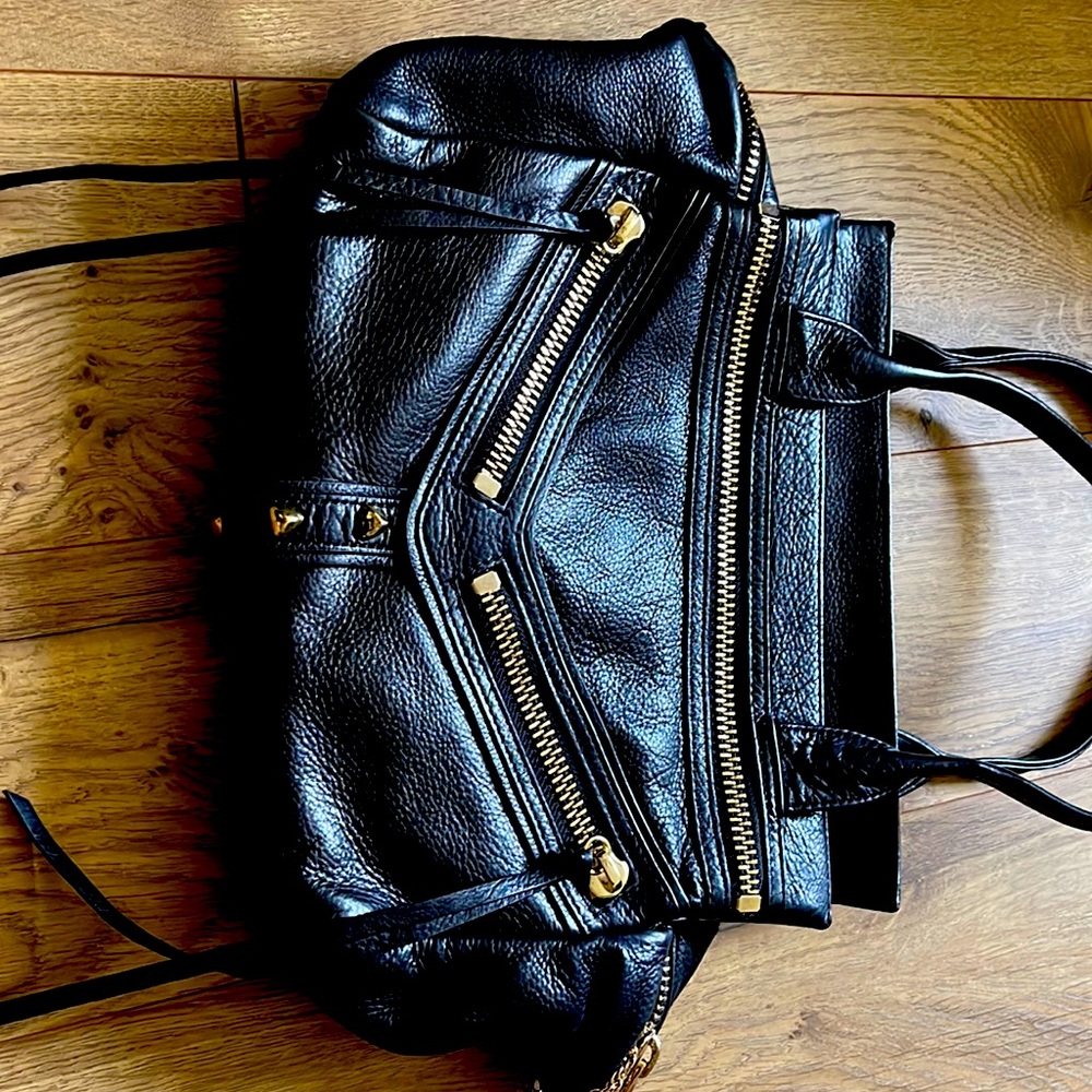 Botkier trigger handbag. Black with gold hardware. Interior pocket and zip